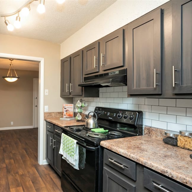 Kitchen with dark cabinetry at S&S Property Management in Nashville, Tennessee