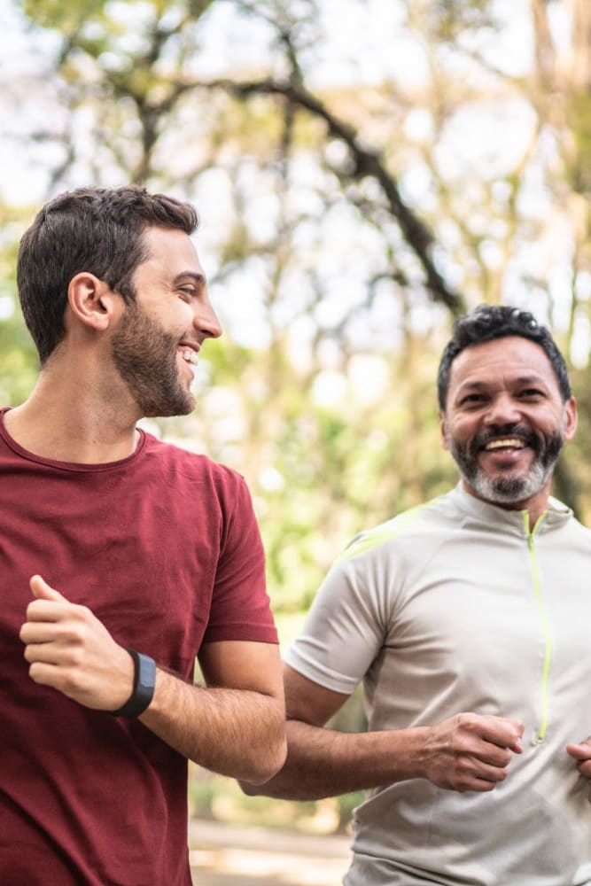 Men jogging in a park near Del Corazon Apartments in Santa Rosa, California