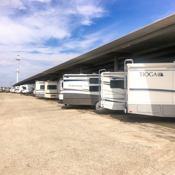 Covered outdoor RV parking spaces at StorQuest Self Storage in Port St Lucie, Florida
