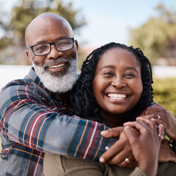 A resident and daughter hugging at Pacifica Senior Living Sterling in Sterling, Virginia. 