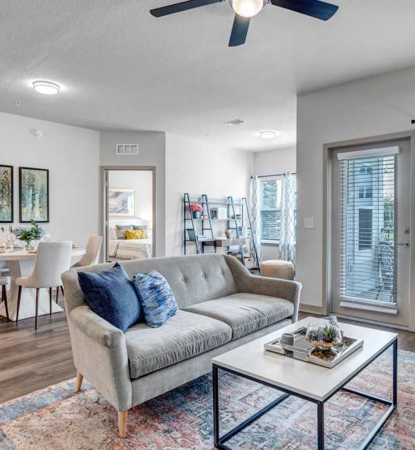 Spacious living room with dining area and natural light at The Carlton At Lake Dexter in Winter Haven, Florida