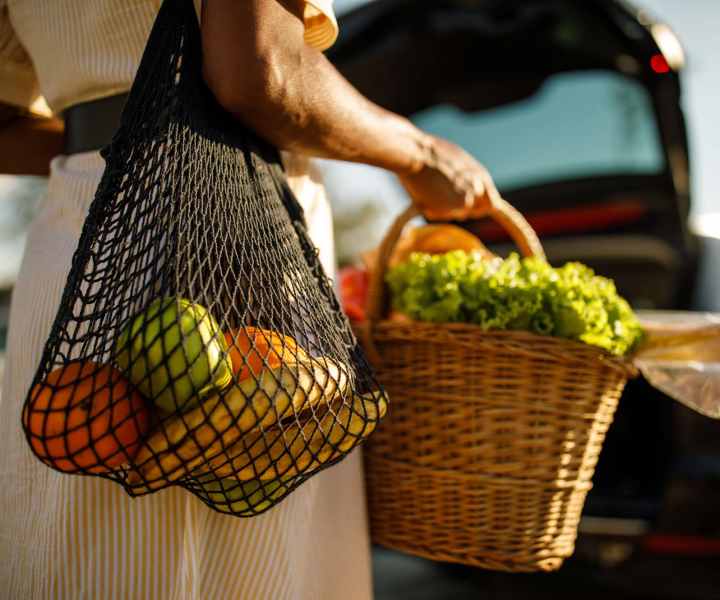 Resident moving to the car picking up some fresh fruits and vegetables at High Street Lofts in Petersburg, Virginia