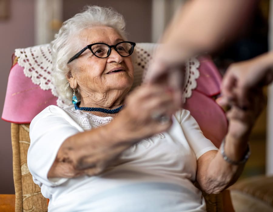 Resident receiving a helping hand at Sunny Days Assisted Living in Hollywood, Florida