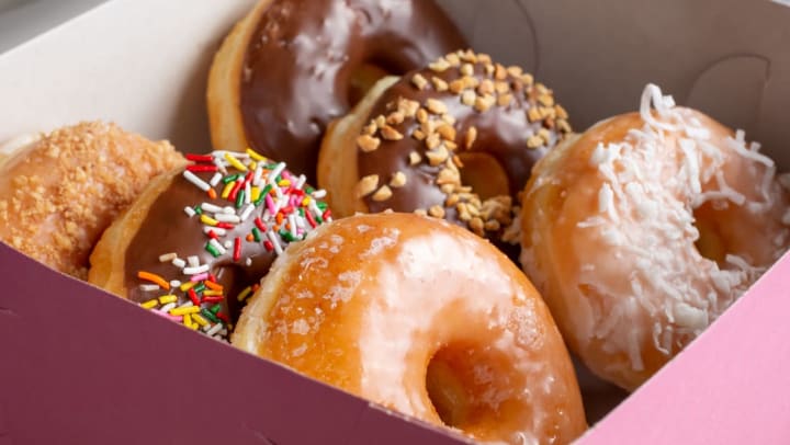 pink box of assorted donuts | donuts in Albuquerque