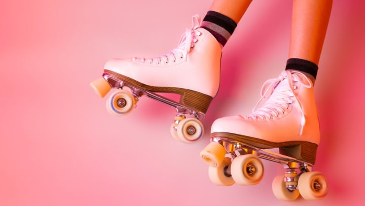 Retro classic white leather roller skates on a girl