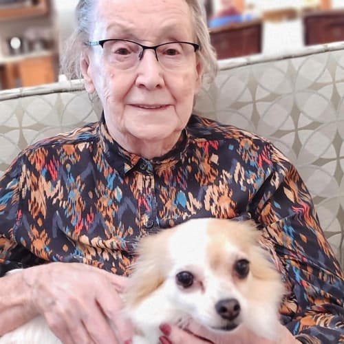 Resident with her dog at Glen Carr House Memory Care in Derby, Kansas