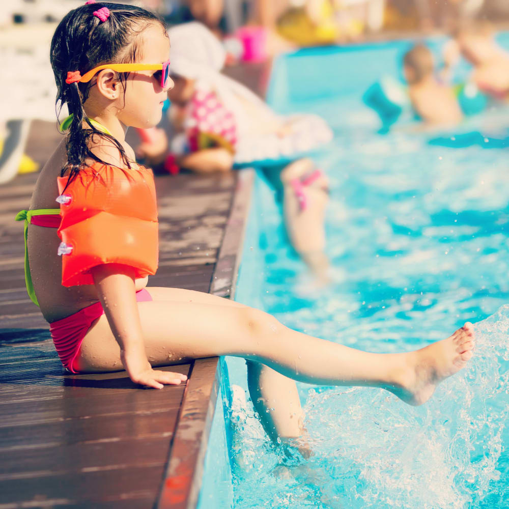 Young girl enjoying the pool at The Cooper in Mount Pleasant, South Carolina