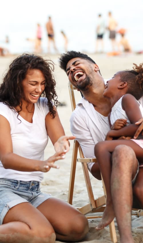 Cute family spending time on the beach near Eastgold Long Island in Long Beach, New York