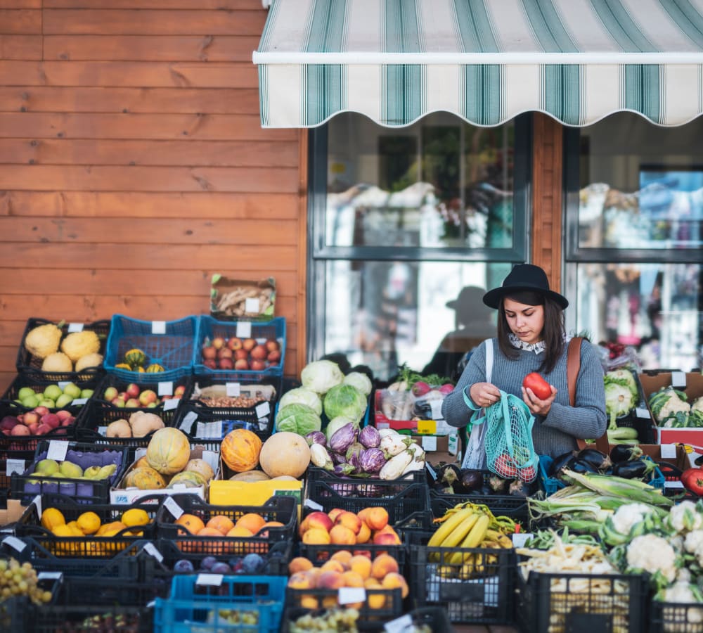 Resident shopping at a produce stand outside near Arbor Gates in Fairhope, Alabama