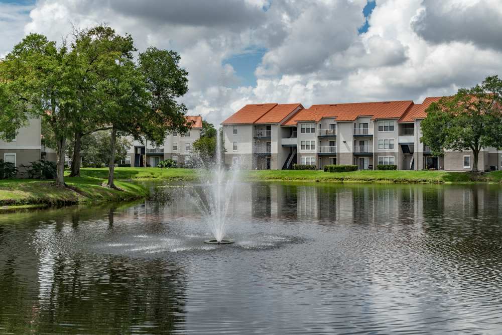 A fountain centered in lake near Isles at East Millenia in Orlando, Florida