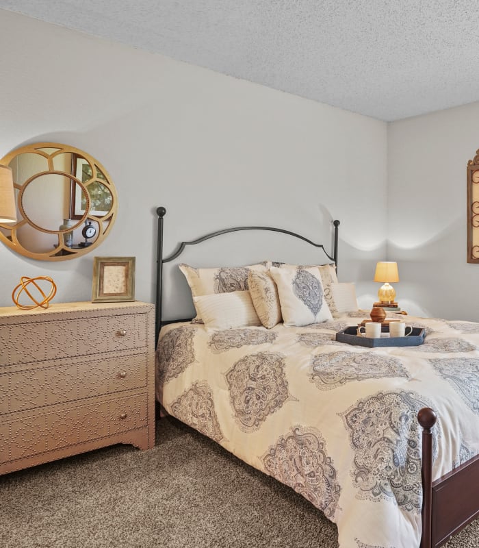 Spacious fresh carpeted bedroom at Silver Springs Apartments in Wichita, Kansas