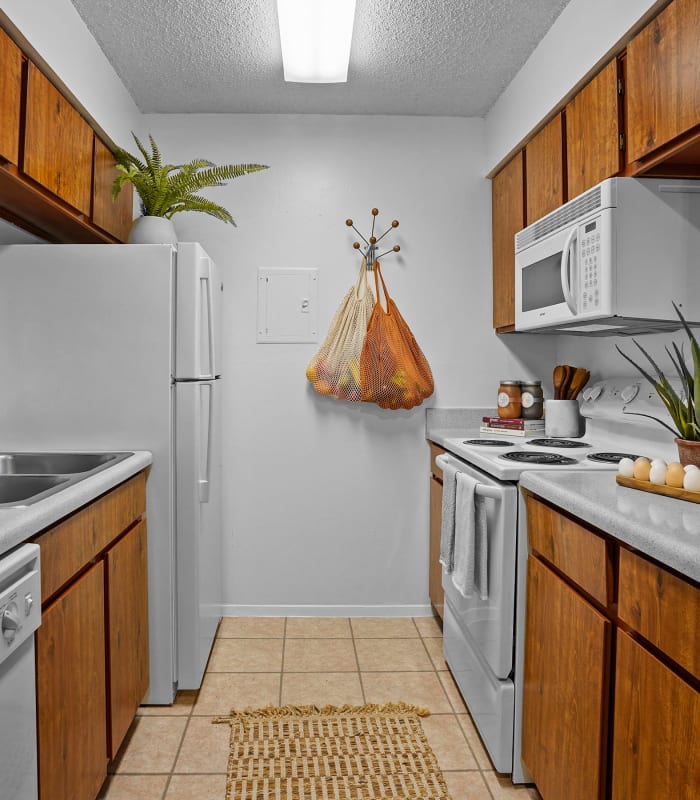 Kitchen with granite countertops at Double Tree Apartments in El Paso, Texas