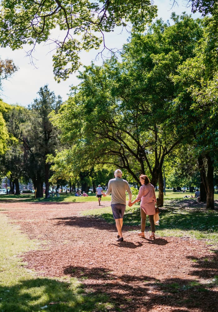 A couple walking through a park near The Gables in Ridgeland, Mississippi