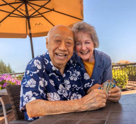 Resident couple poses for a picture at Merrill Gardens at Barkley Place in Fort Myers, Florida. 