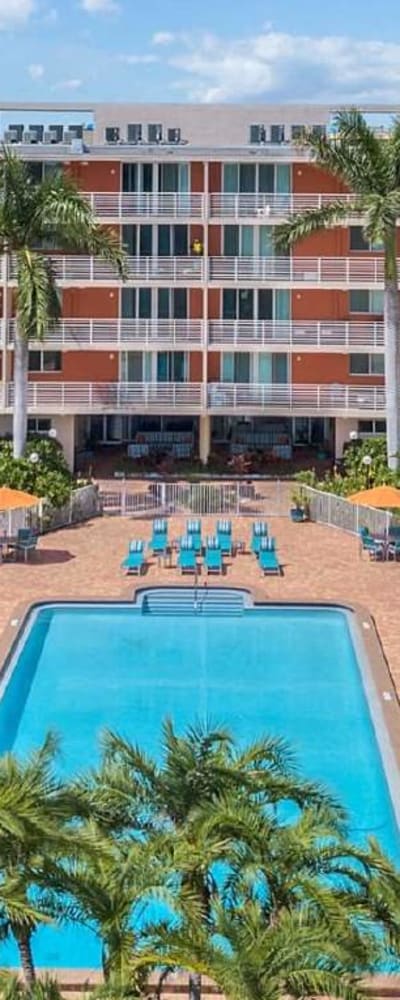 Large inground pool with lots of lounge seating at Vue at Robbins Property Associates, LLC in Tampa, Florida
