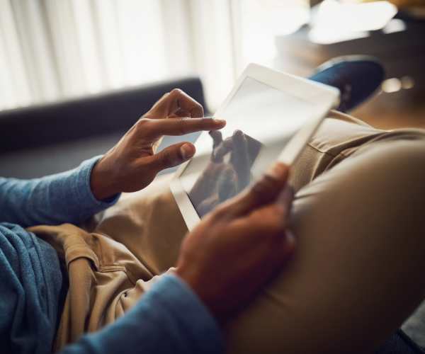 Resident on his tablet Targa Real Estate Services, Inc. in Federal Way, Washington