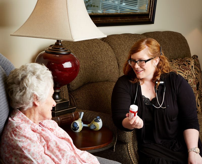 Residents and staff talking about medication at Aurora on France in Edina, Minnesota