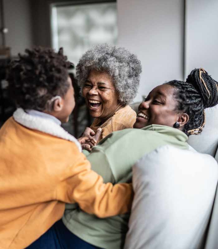Family enjoying quality time together at home Penn Lincoln Apartments in Wilkinsburg, Pennsylvania