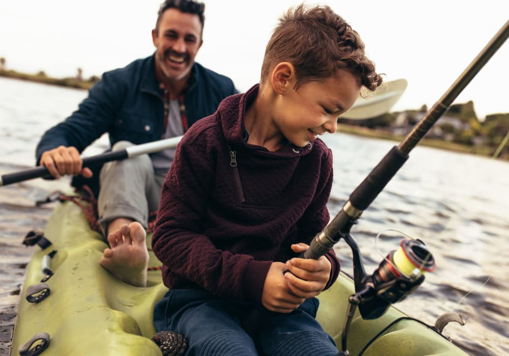 Father and son fishing from a kayak near Sherwood in Folsom, California
