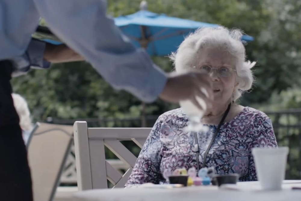 Resident being waited on at a Anthology of Overland Park community