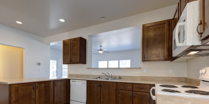 A well-lit kitchen in a home at Cascade Village in Joint Base Lewis McChord, Washington