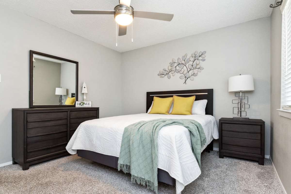 Bedroom with plush carpeting at Stonehill in Killeen, Texas