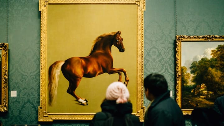 Patrons admiring a painting of a horse at a museum near Sedona Ranch in Odessa, Texas