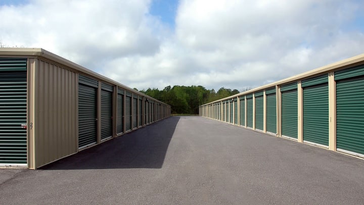 row of storage units in a parking lot