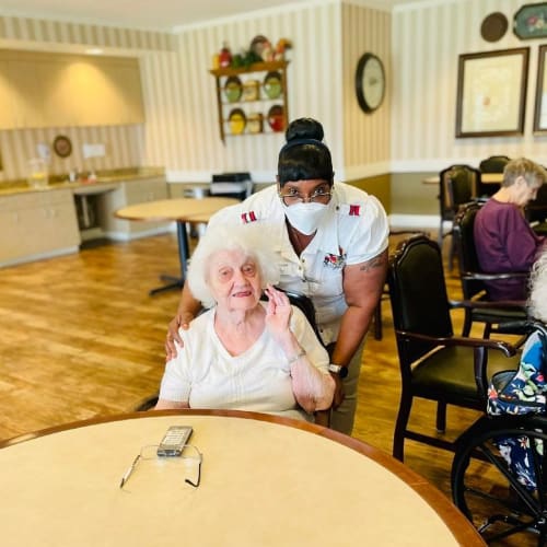 Group of residents having tea and biscuits at Riverside Oxford Memory Care in Ft. Worth, Texas