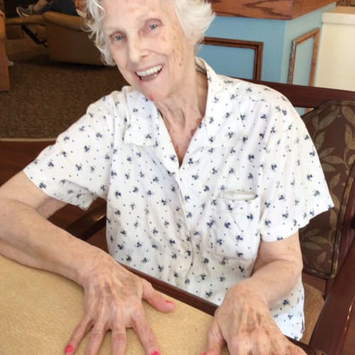 Resident smiling at Oxford Glen Memory Care at Carrollton in Carrollton, Texas