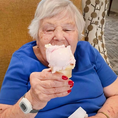 Resident eating ice cream at The Oxford Grand Assisted Living & Memory Care in Kansas City, Missouri