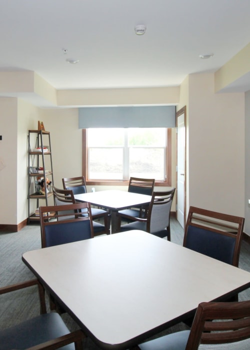 Craft room with tables and chairs at The Pillars of Mankato in Mankato, Minnesota
