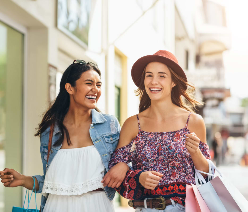 Women shopping in the neighborhood near Sienna Heights Apartment Homes in Lancaster, California