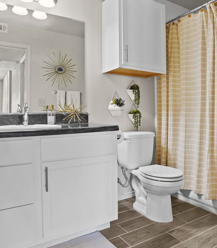 Bathroom with tile flooring at Watercress Apartments in Maize, Kansas