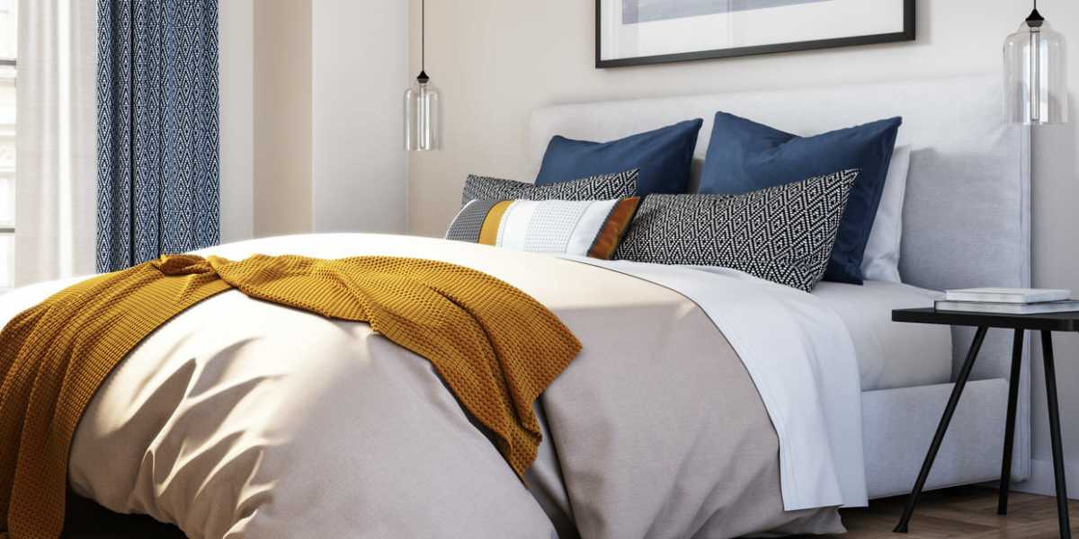 A modern, furnished bedroom at Capitol Green in Albany, New York