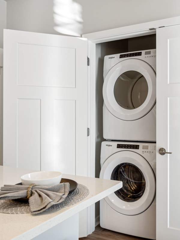 In-unit stacked washer and dryer at Seasons at Hoffman Estates in Hoffman Estates, Illinois