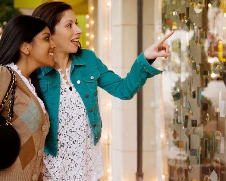 Women looking at an item behind the glass at a shop in Haddon Heights