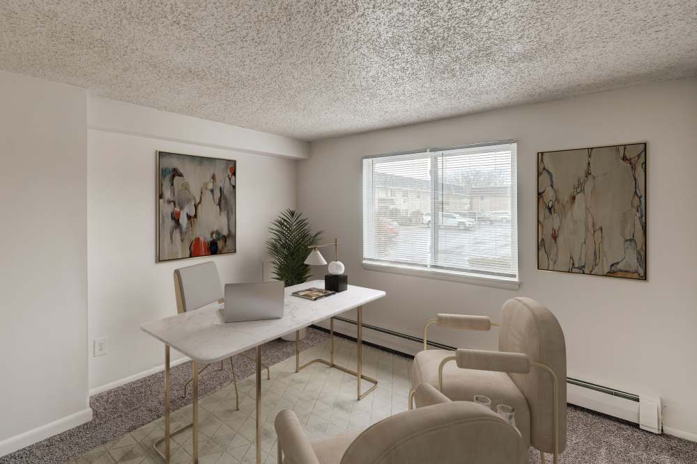 Bedroom with wall to wall carpeting, staged as a home office