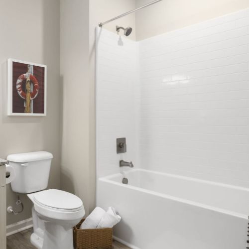 Bright bathroom with shower and tub at  Hudson at Carolina Colours in New Bern, North Carolina