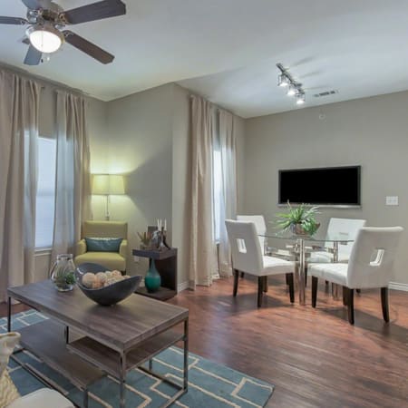 Beautifully staged living area and dining room at Latigo at Eagle Pass in Eagle Pass, Texas