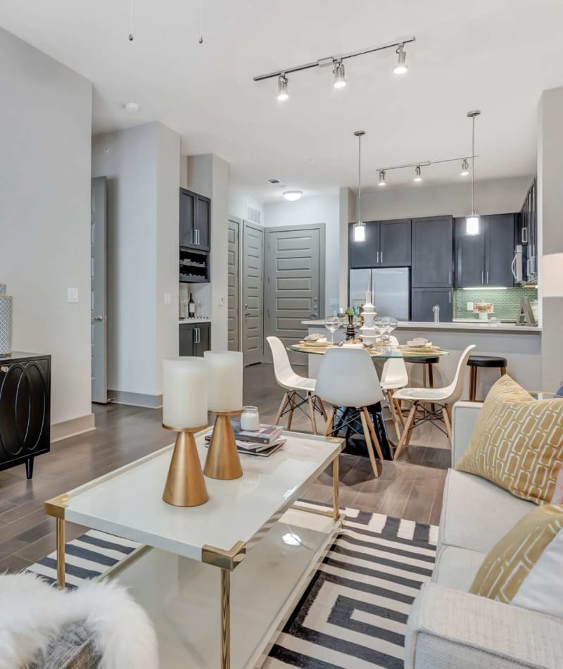 Open living space with wood-style flooring at Anthem Cityline in Richardson, Texas