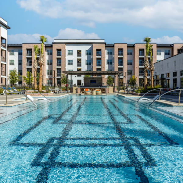 Luxurious inground pool with lounge chairs at Bellrock La Frontera in Austin, Texas