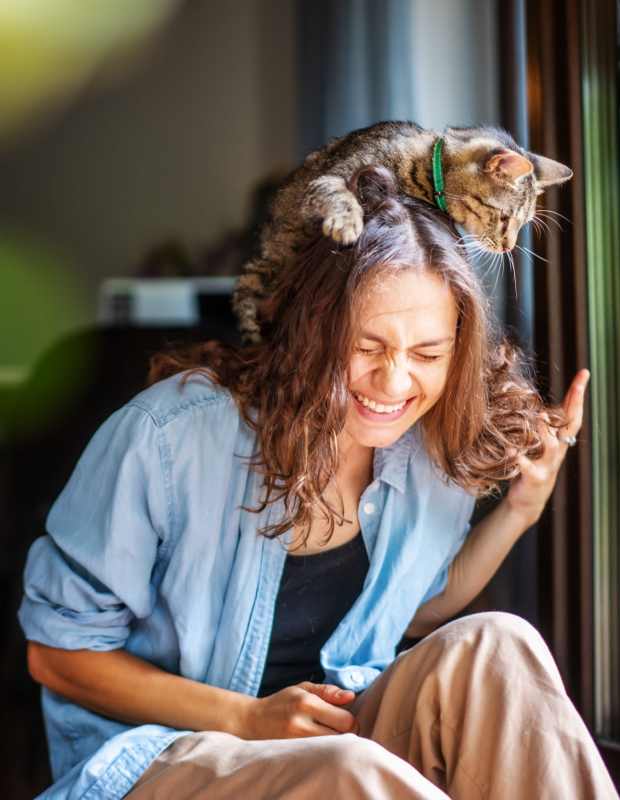 Resident and her cat in an apartment at The Annex at Bridgeton in Portland, Oregon