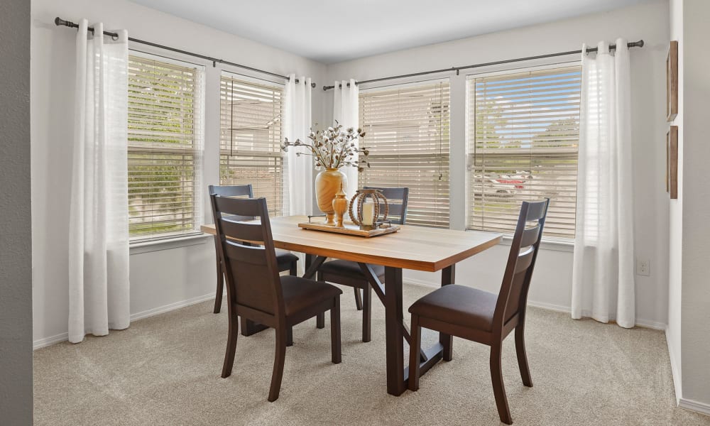 Chair and table at Cottages at Tallgrass Point Apartments in Owasso, Oklahoma