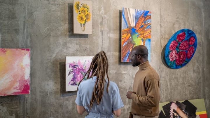 Couple looking at unique artworks in a gallery | Bentley Gallery