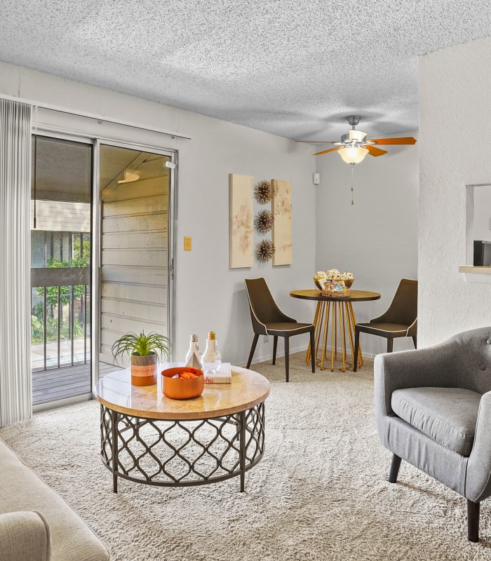 Carpeted living room at Sunchase Apartments in Tulsa, Oklahoma