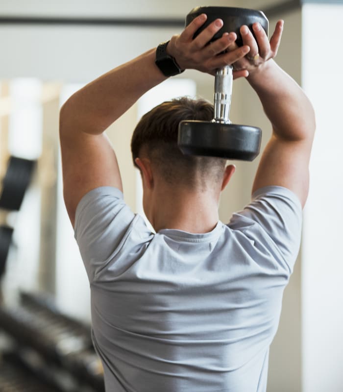 Resident working out in the gym at Silo Creek Apartments in Lafayette, Louisiana