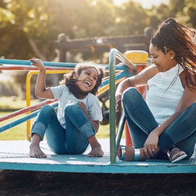 a resident and her daughter playing on a playground near Stanley Court in Portsmouth, Virginia