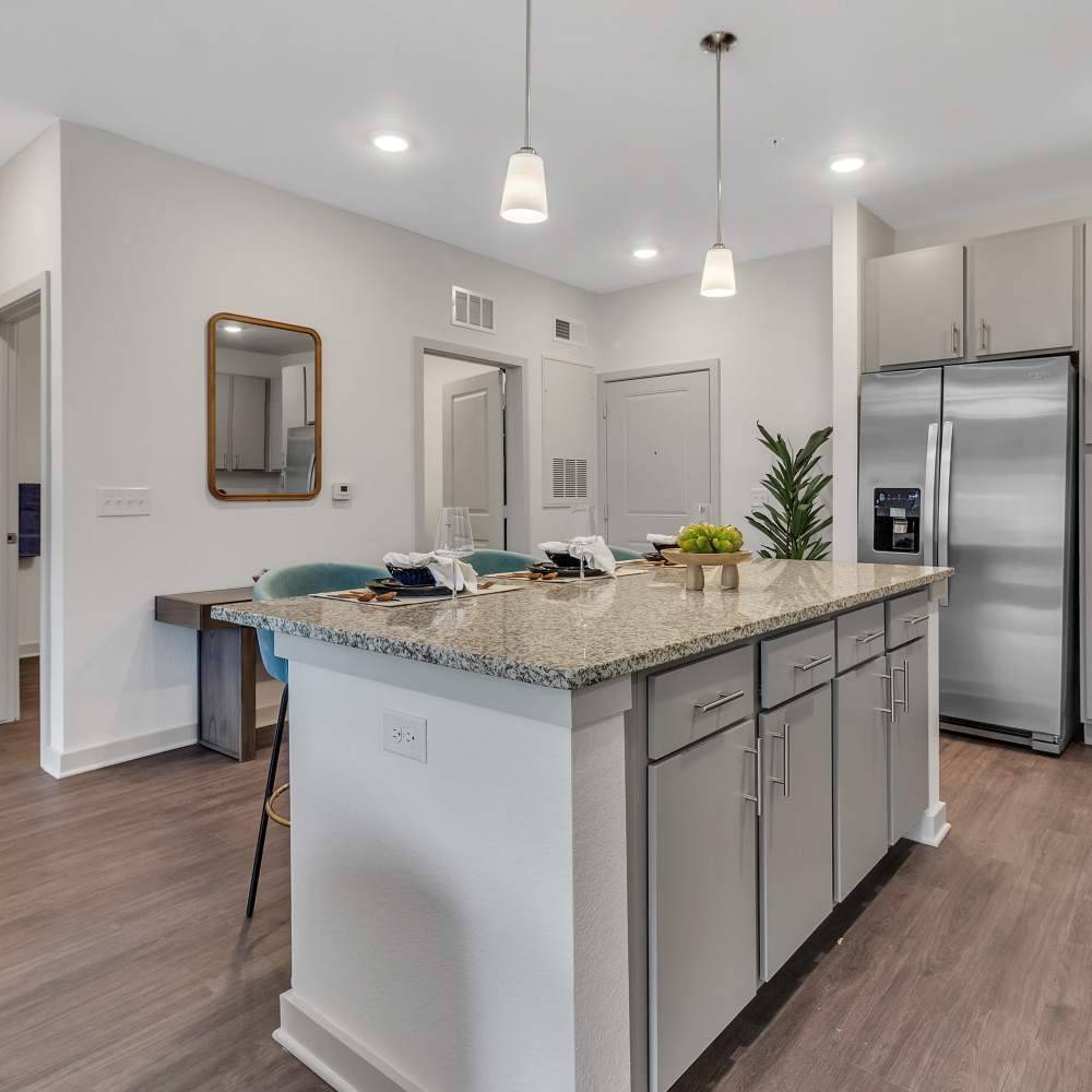 An apartment kitchen with an island at Seaton Preserve in Jacksonville Florida