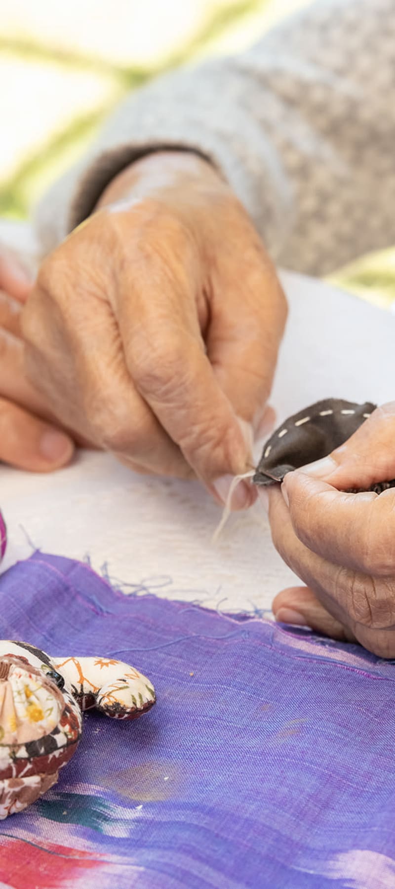 Resident sewing at Montello Care Center in Montello, Wisconsin